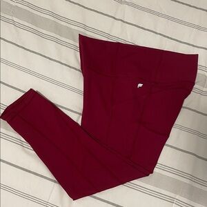 Fabletics PureLuxe Oasis High-Waisted Pocket Capri Leggings in Deep Red